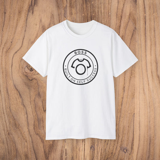 White t-shirt with a black logo on a wooden surface