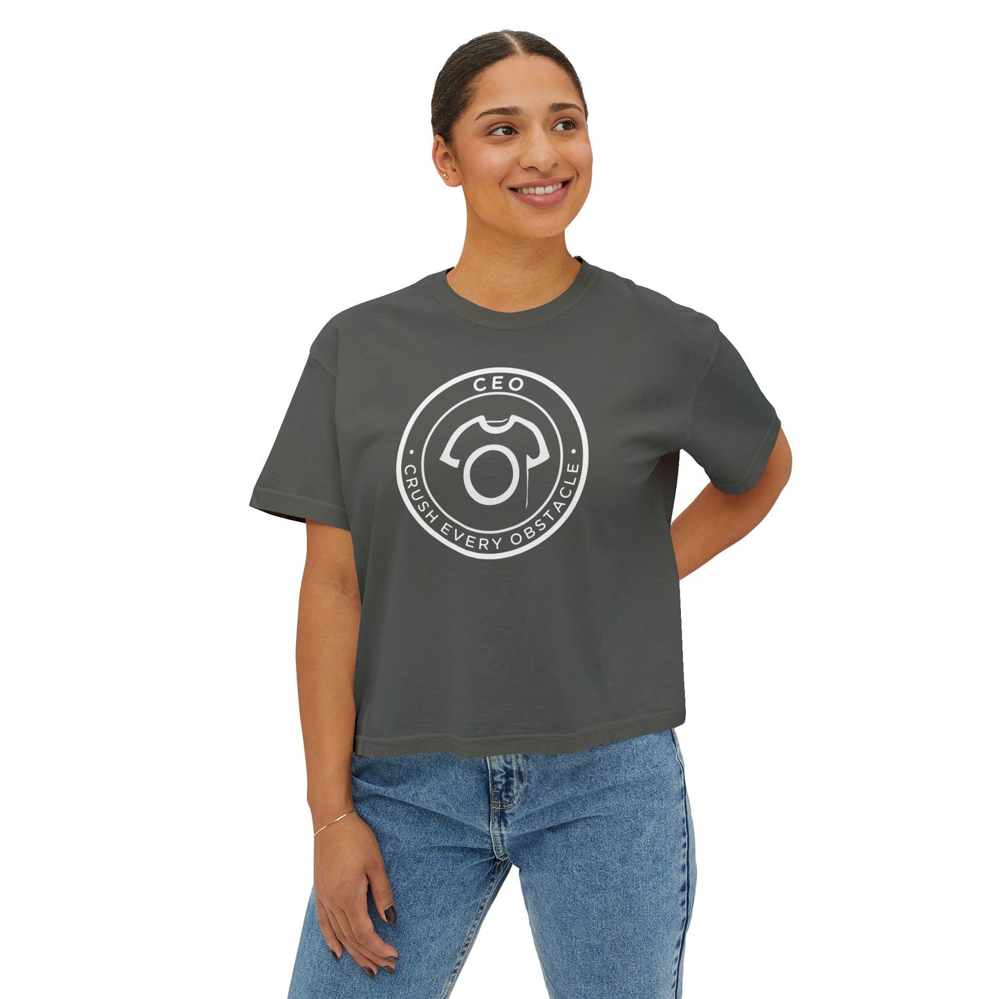 Woman wearing a gray t-shirt with a logo and text on a white background