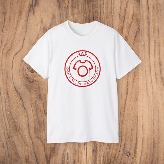White t-shirt with a red graphic design on a wooden surface